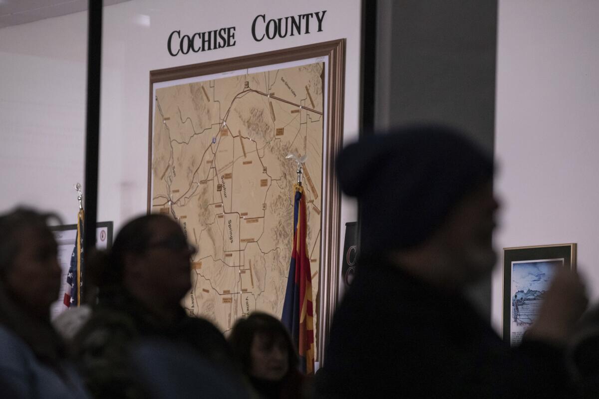 Members of the public attend a Cochise County Board of Supervisors meeting.