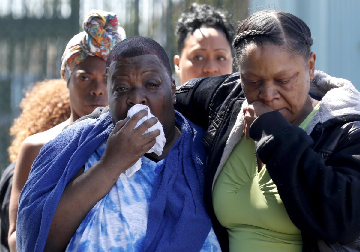 Beverly Owens, the mother of bicyclist Frederick Frazier, is overcome with emotion. Her son was struck and killed while riding his bicycle near Manchester and Normandie avenues in South L.A. in April.
