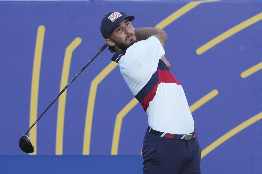 United States' Max Homa plays his shot off the 1st tee during his morning Foursomes match at the Ryder Cup golf tournament at the Marco Simone Golf Club in Guidonia Montecelio, Italy, Saturday, Sept. 30, 2023. (AP Photo/Andrew Medichini)