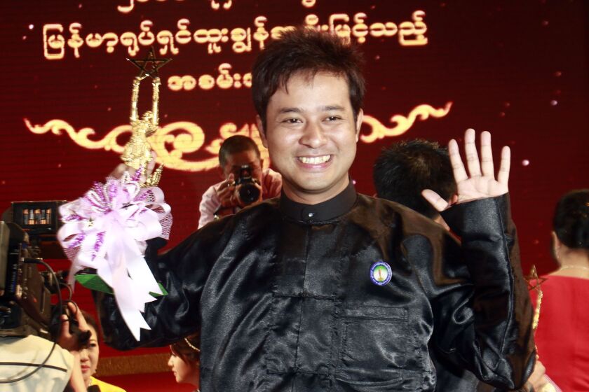FILE - Myanmar actor Pyay Ti Oo, a winner of the best actor award, poses for photos during Myanmar Motion Picture Outstanding Awards (Academy Awards) Presentation ceremony in Naypyitaw, Myanmar, Tuesday, Feb.7, 2012. Several top Myanmar celebrities, including Pyay Ti Oo, who were detained for criticizing the army's seizure of power were released from prison Wednesday, March 2, 2022, under pardons issued by the military government, state-run television reported. (AP Photo/Khin Maung Win, File)