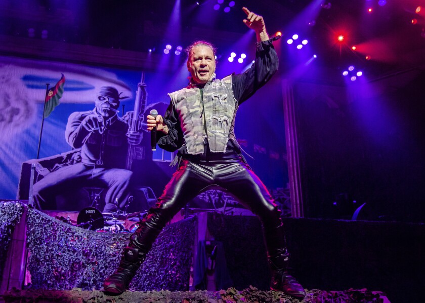 FILE - Bruce Dickinson of Iron Maiden performs in Cincinatti on Aug. 15, 2019. Dickinson is about to resume his spoken-word tour in the U.S. where he speaks about his life, being a rock star and a host of other topics, including his bout with throat cancer. (Photo by Amy Harris/Invision/AP, File)