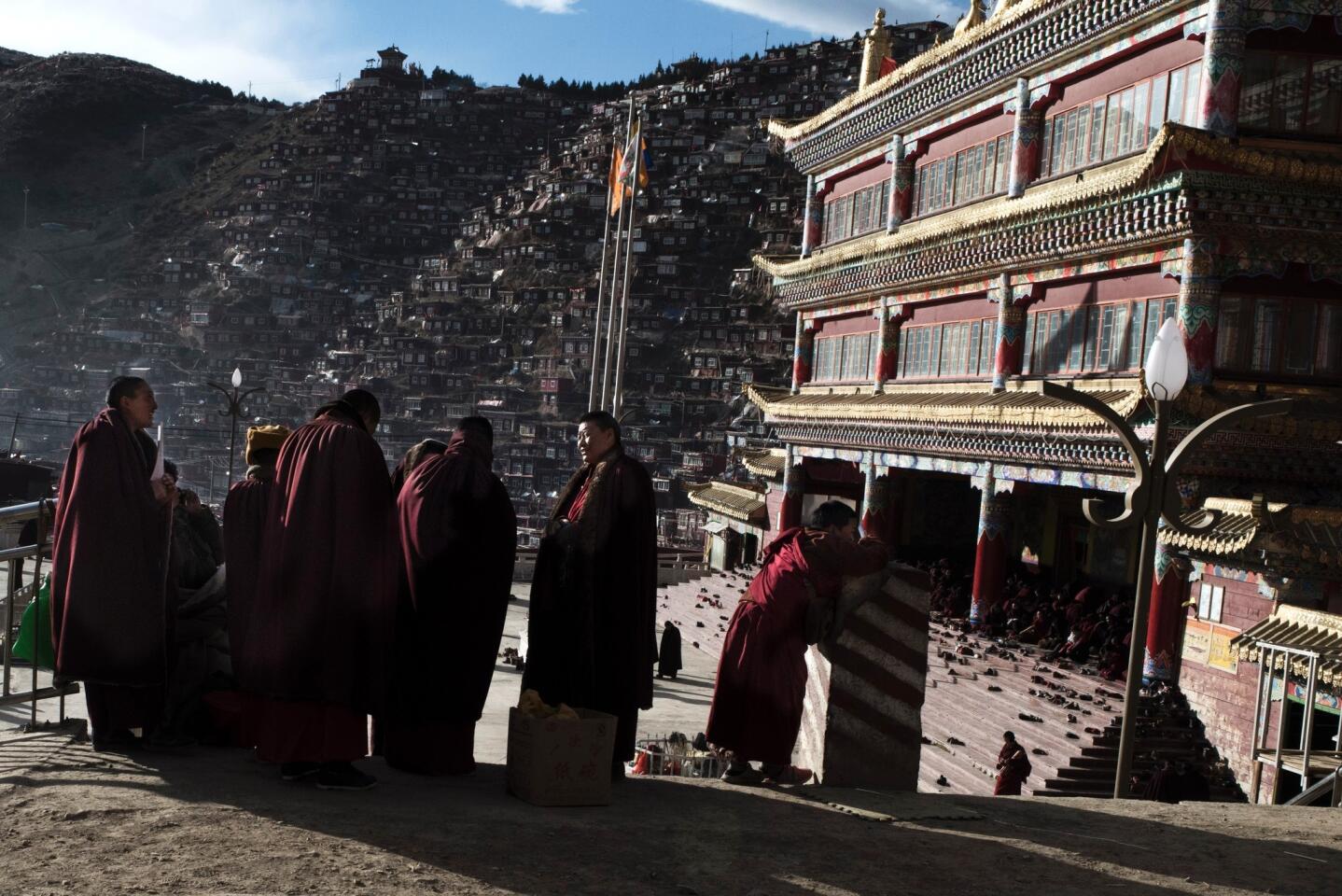 Buddhist nuns gather at the Larung Gar Buddhist Institute, where up to 40,000 monks and nuns are in residence for parts of the year. A notice from local officials began circulating in recent months saying that Larung Gar’s population must be reduced to no more than 5,000 residents by Sept. 30.