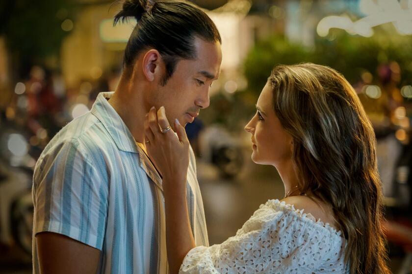 Scott Ly and Rachael Leigh Cook in the movie "A Tourist's Guide to Love."