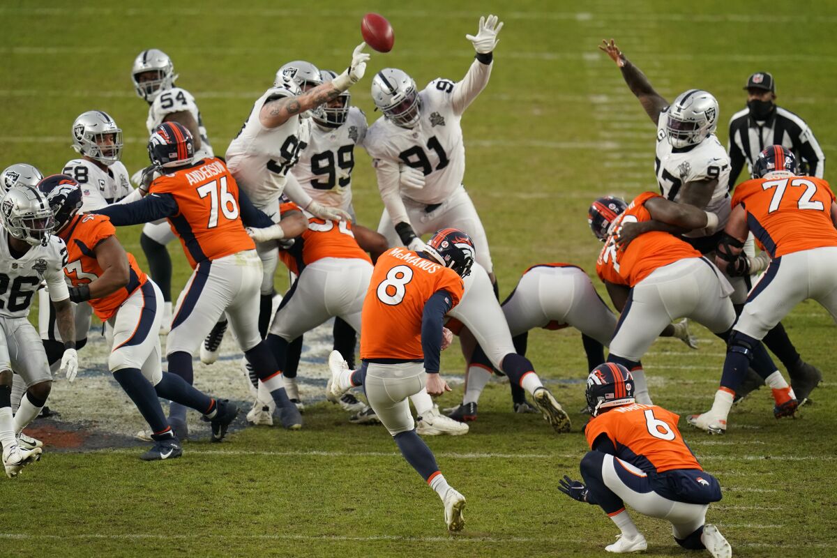 Las Vegas Raiders block a field goal attempt by Denver Broncos kicker Brandon McManus (8) during the first half of an NFL football game, Sunday, Jan. 3, 2021, in Denver. (AP Photo/Jack Dempsey)