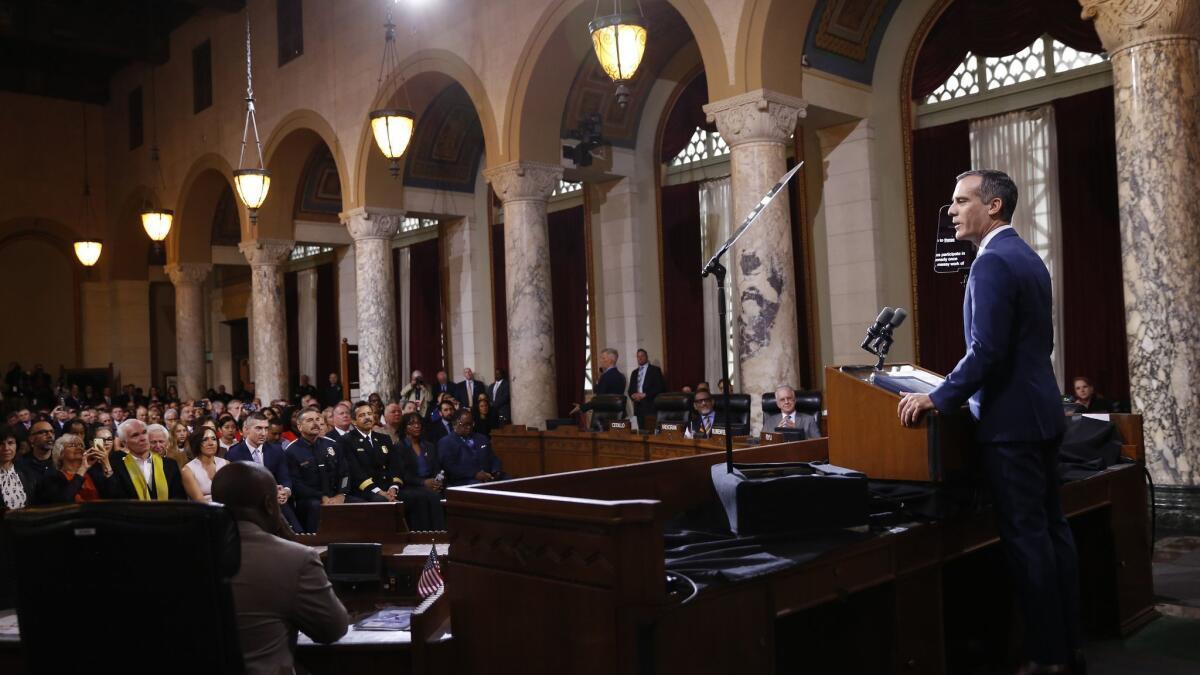 Mayor Eric Garcetti delivers his State of the City address in Los Angeles City Hall council chambers. Los Angeles is sending back $425,000 in federal money to the Department of Homeland Security after lawmakers stalled on whether to take the funding.