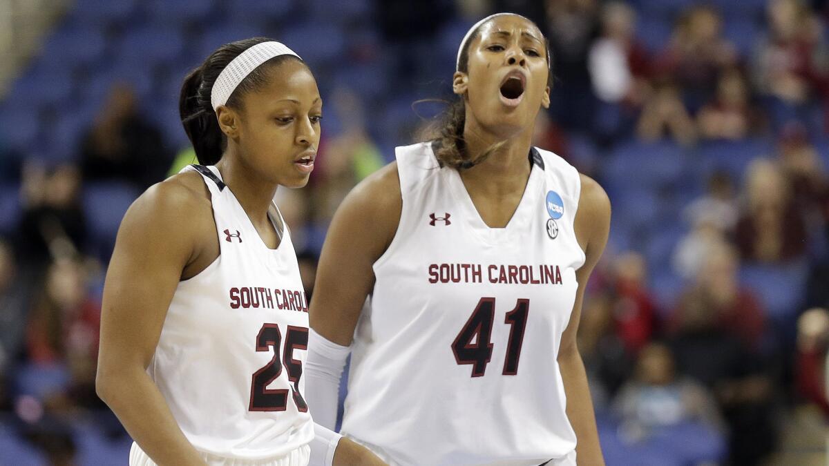South Carolina's Tiffany Mitchell, left, and Alaina Coates react during the team's 80-74 win over Florida State in the NCAA women's tournament on Sunday.