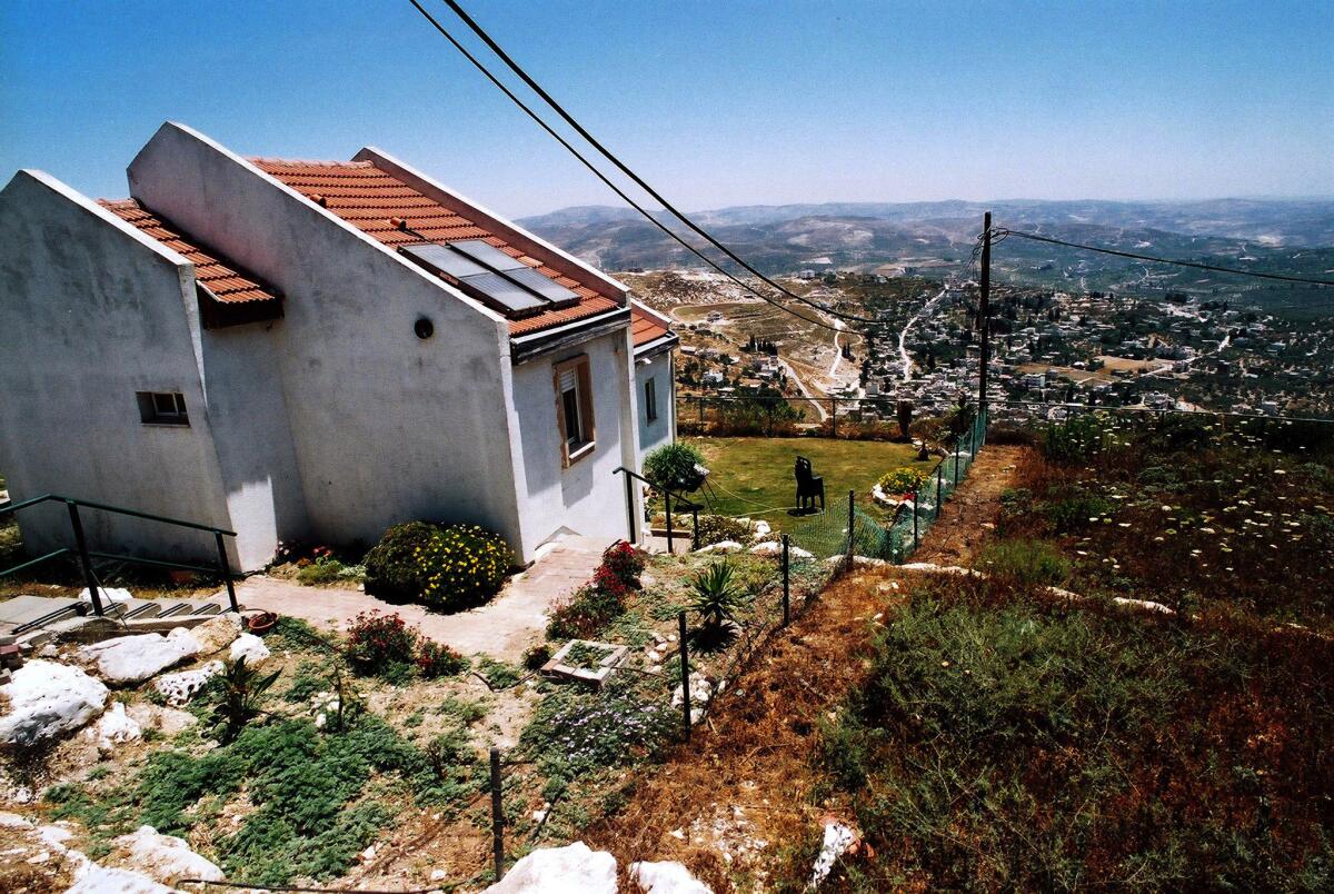 This file photo from June 9, 2005, shows a house in Homesh, a Jewish settlement in the West Bank that was ordered abandoned and returned to Palestinian control.