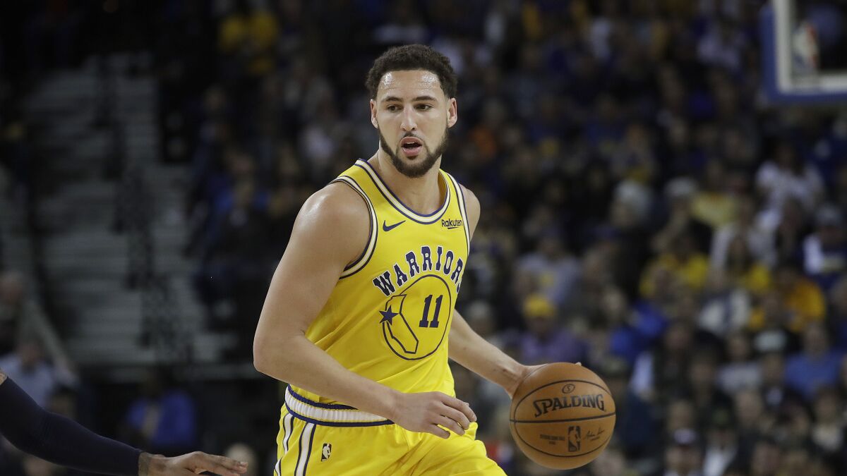 Golden State Warriors guard Klay Thompson plays against the Denver Nuggets.