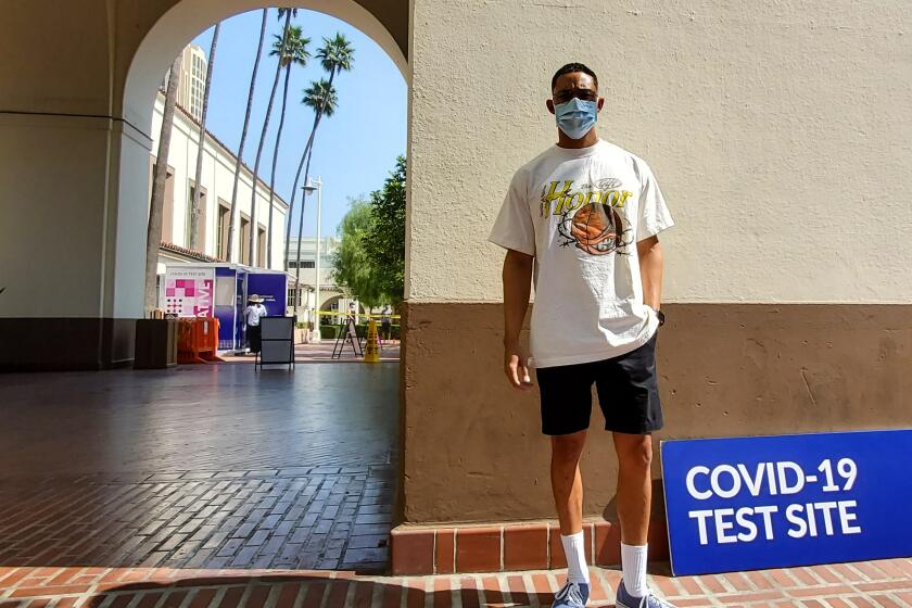 Aaron Sanders arrives to for his COVID-19 test at Union Station in Los Angeles.