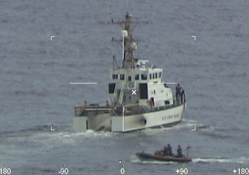FILE - Coast Guard Cutter Ibis' crew searching for people missing from a capsized boat off the coast of Florida, Tuesday, Jan. 25, 2022. The sole survivor of a capsized boat found off Florida’s coast was a young Colombian man traveling with his younger sister, Colombia's government said Friday, Jan. 28. (U.S. Coast Guard via AP)