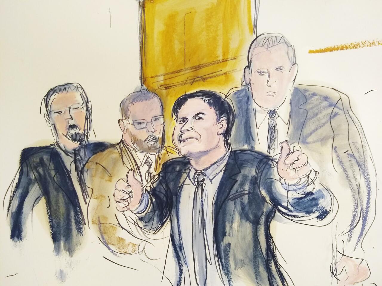 Joaquin "El Chapo" Guzman gestures "thumbs up" to his wife as U.S. marshals remove him from the courtroom after he was found guilty of drug-trafficking in New York.