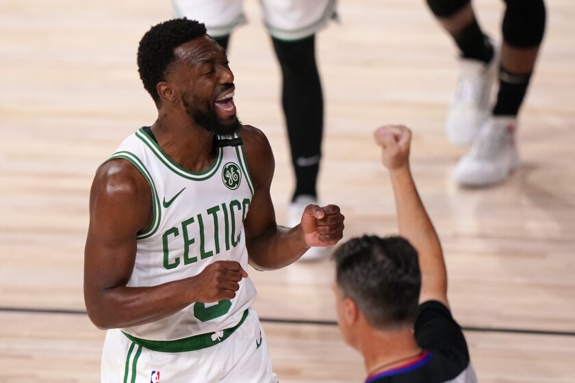 Boston Celtics' Kemba Walker (8) reacts to being called for a foul during the first half of an NBA conference final playoff basketball game against the Miami Heat Sunday, Sept. 27, 2020, in Lake Buena Vista, Fla. (AP Photo/Mark J. Terrill)