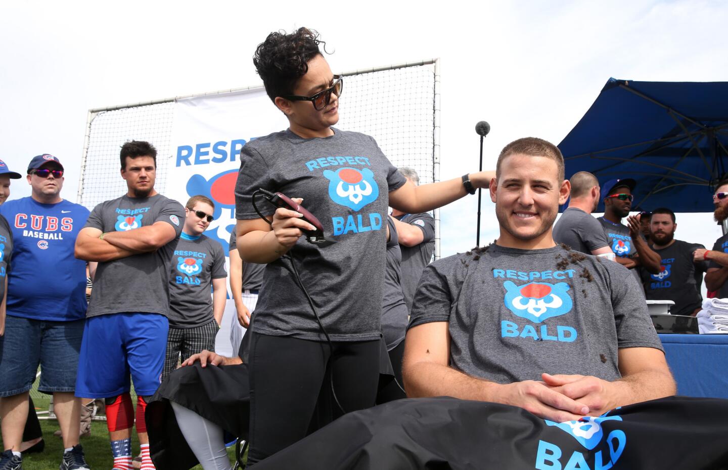 Cubs first baseman Anthony Rizzo has a laugh while having his head shaved as he and other members of the organization participated in the Respect Bald Fundraiser prior to a preseason game at Sloan Park in Mesa, Ariz., on Saturday, March 5, 2016. Rizzo, manager Joe Maddon, Kyle Schwarber, and Ben Zobrist were among those who shaved their heads to benefit pediatric cancer research and support.