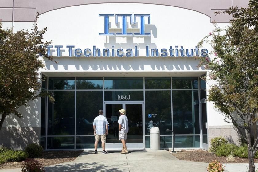 Harold Poling, left, and Ted Weisenberger found the doors to the ITT Technical Institute campus closed after ITT Educational Services announced that the school had ceased operating, Tuesday, Sept. 6, 2016, in Rancho Cordova, Calif. The Carmel Ind., based company, which operates vocational schools, announced in a statement, Tuesday, that "with profound regret" it is ending academic operations at all of its more than 130 campuses across 38 states. Weisenberger was one quarter short of getting his degree in project management, and Poling was going to began taking classes in cybersecurity next week. (AP Photo/Rich Pedroncelli)
