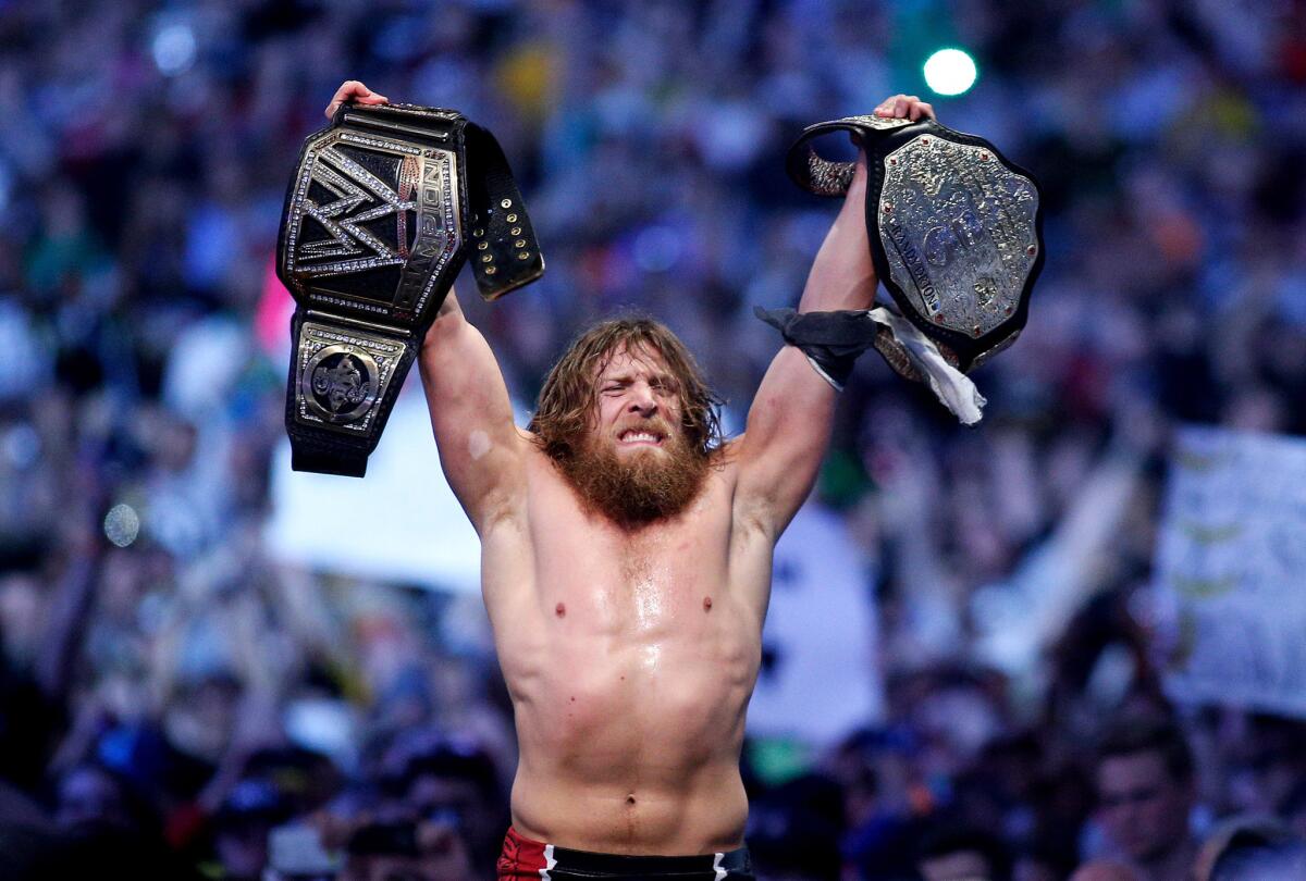 Daniel Bryan celebrates after winning the main event during Wrestlemania XXX. Bryan announced his retirement from the WWE on Monday due to medical issues.