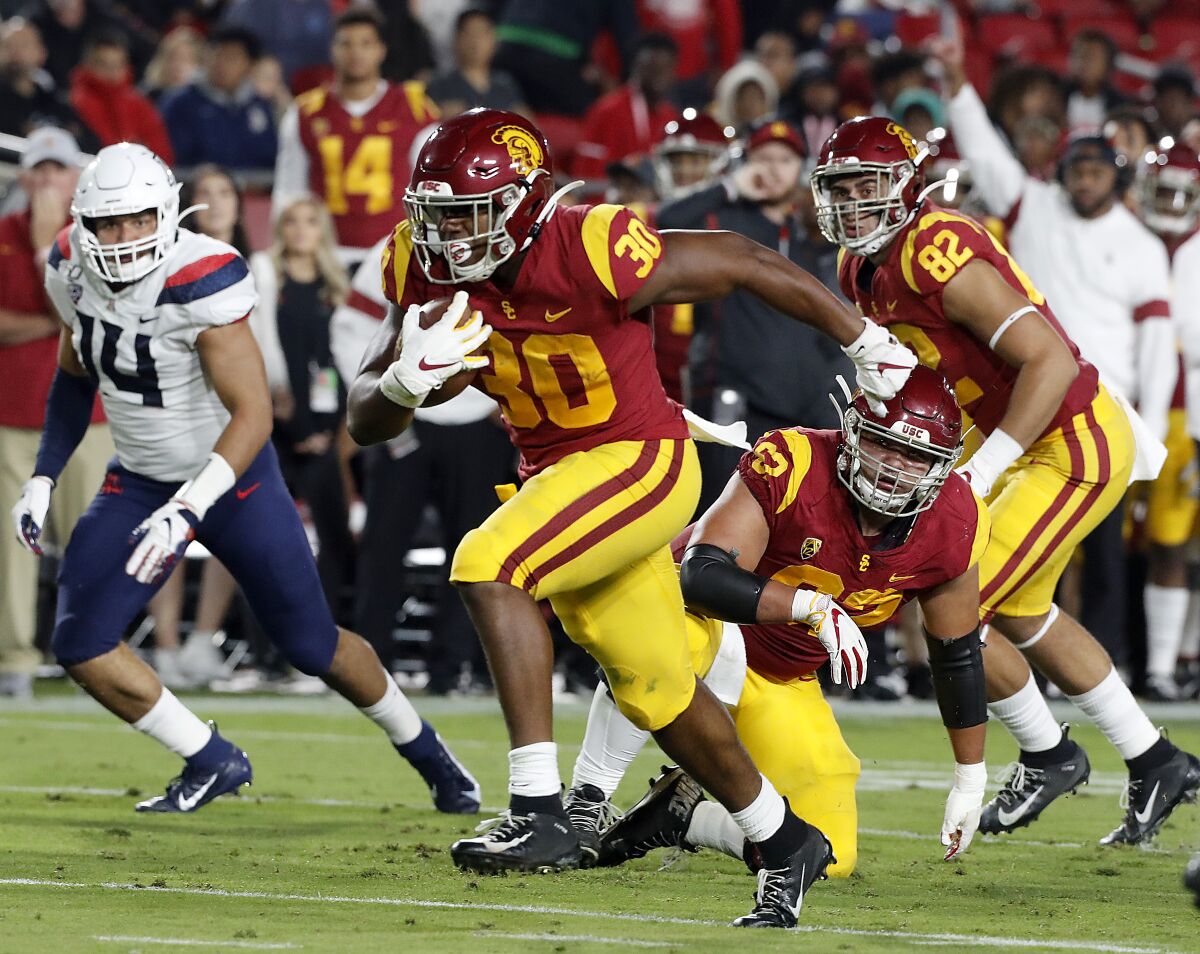 USC's Markese Stepp runs for a touchdown against Arizona in the second quarter at the Coliseum on Saturday.