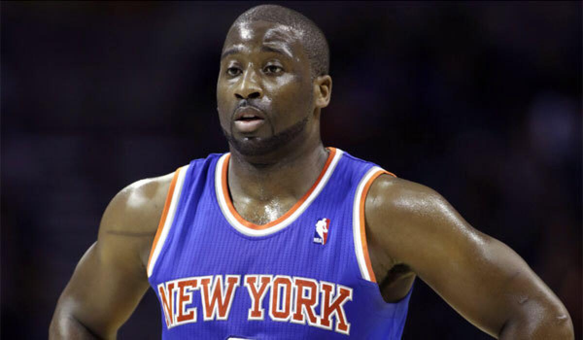 New York Knicks point guard Raymond Felton turned himself in to police early Tuesday morning.