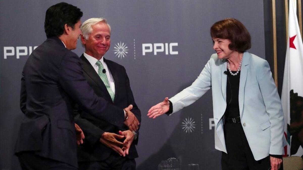 State Sen. Kevin de Leon (D-Los Angeles) and Sen. Dianne Feinstein (D-Calif.) shake hands after their "public conversation" Wednesday in San Francisco.