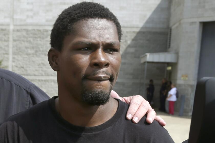 Boxer Jermain Taylor leaves a courthouse in Little Rock, Ark., on Aug. 27 after his arrest on charges that he shot his cousin and threatened another man. Taylor faces new charges after he allegedly fired a gun at a Martin Luther King Jr. Day parade.