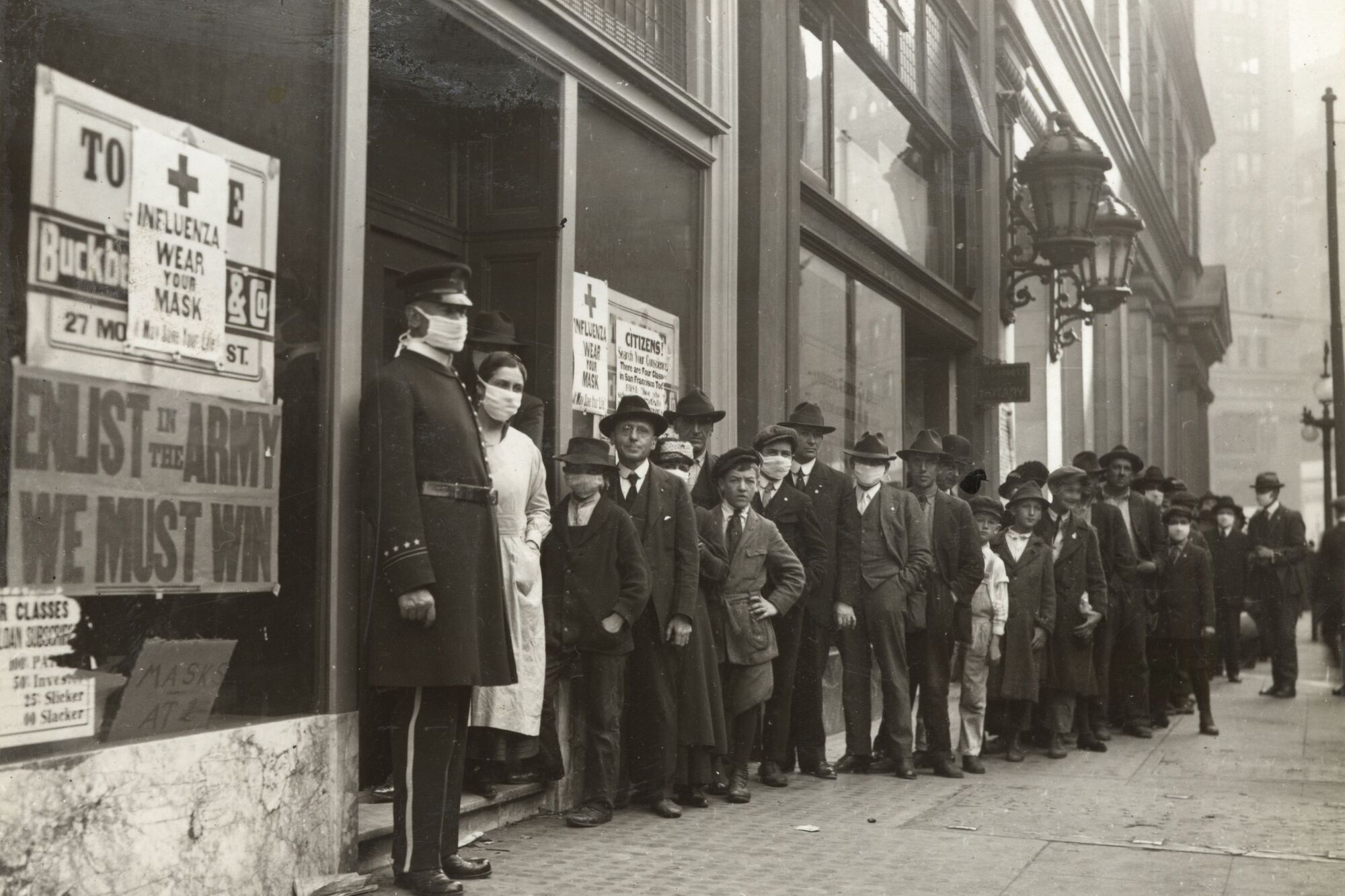 People wait in line to get flu masks on Montgomery Street in San Francisco in 1918.