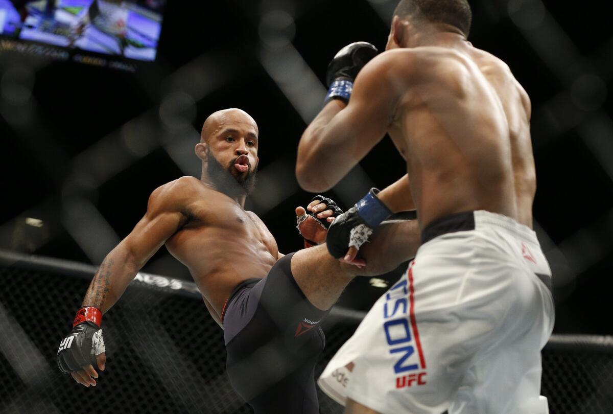 Demetrius Johnson, left, scored another victory over John Dodson during UFC 191 on Saturday night in Las Vegas.
