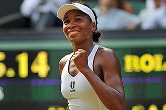 Venus Williams smiles after beating Russia's Dinara Safina during their semifinal match at Wimbledon.