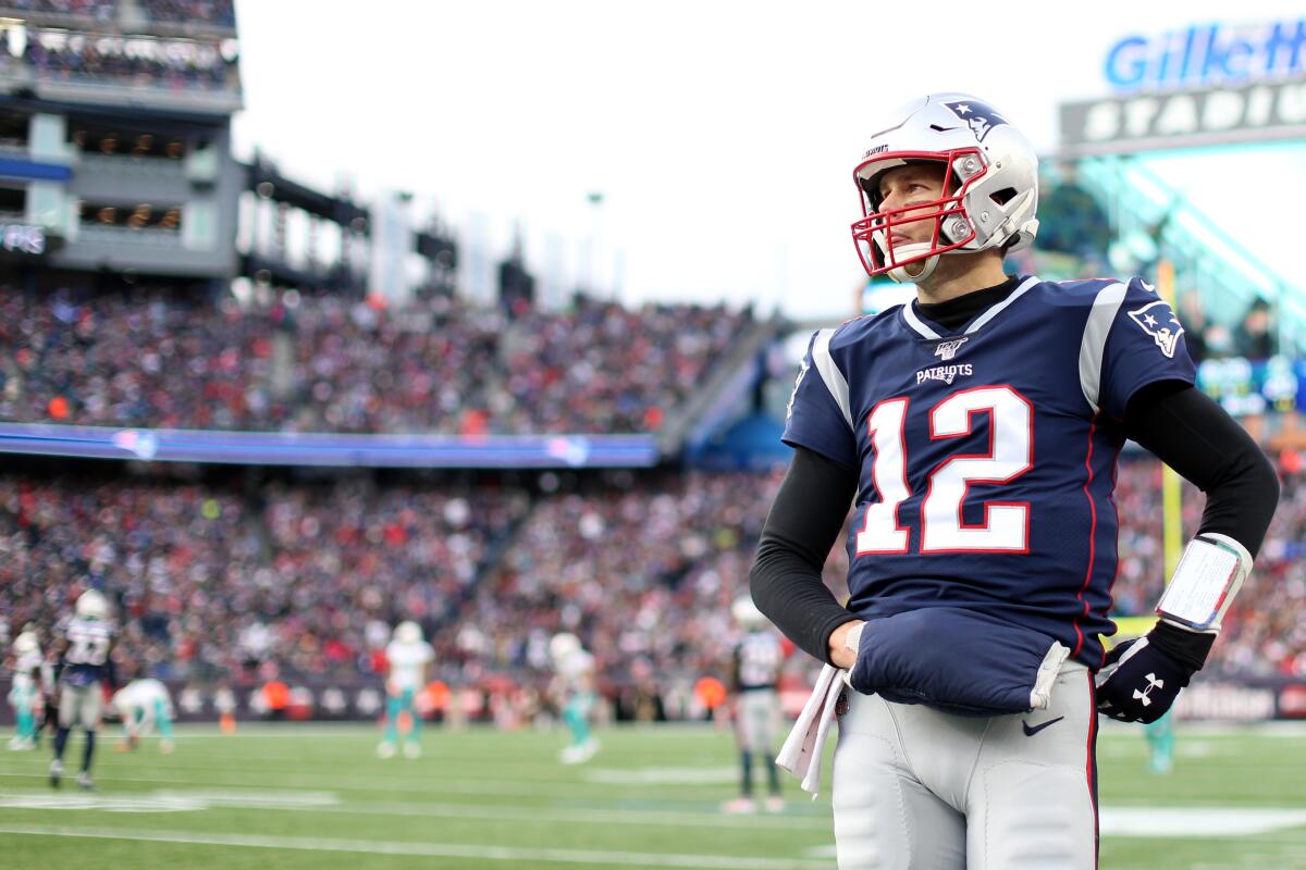 New England Patriots quarterback Tom Brady looks on during the game against the Miami Dolphins  at on Dec. 29, 2019 in Foxborough, Mass.