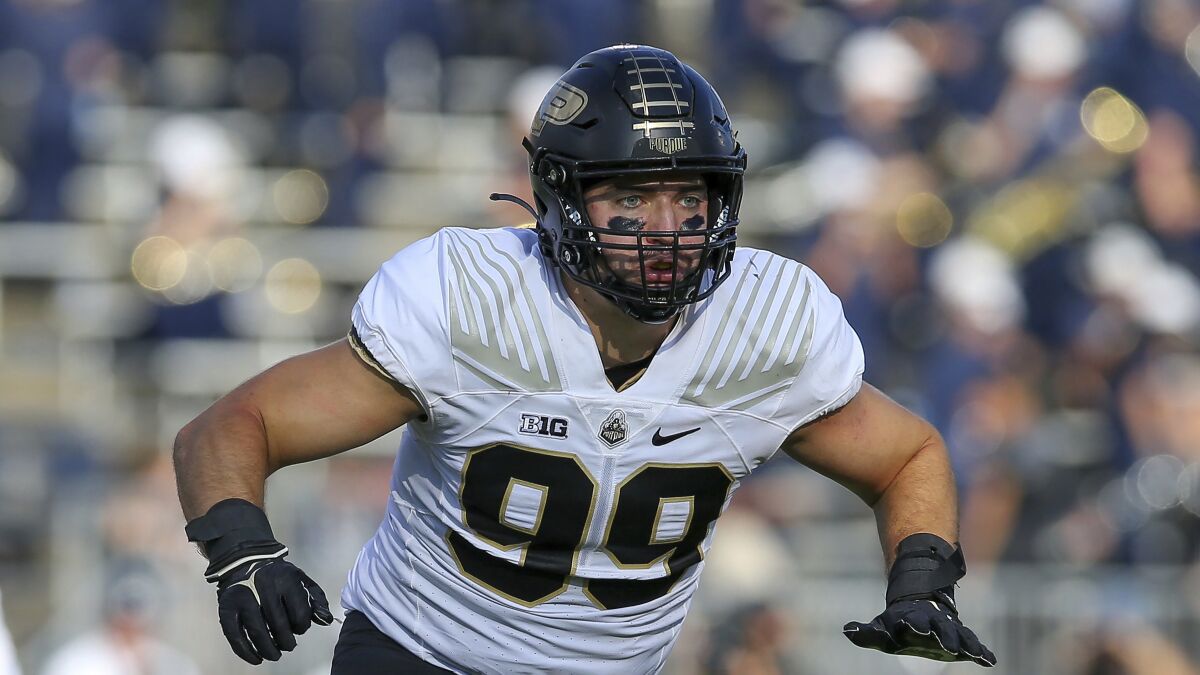 Purdue defensive end Jack Sullivan stands on the field during a game.