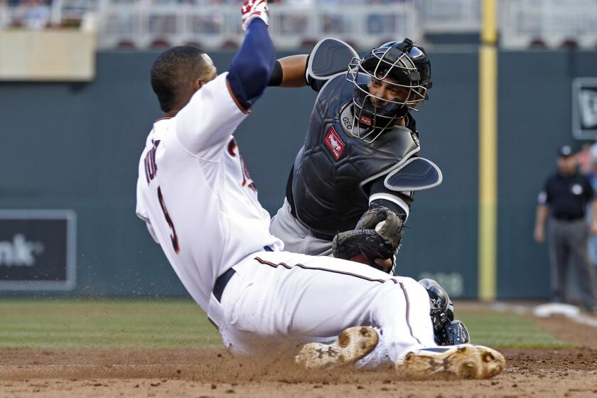 Chicago White Sox catcher Geovany Soto tags out Minnesota Twins infielder Eduardo Nunez, left, during a game on June 23.