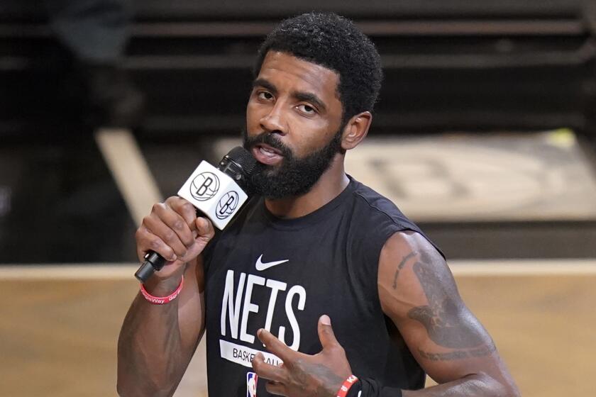 FILE - Brooklyn Nets' Kyrie Irving speaks before the team's NBA basketball game against the New Orleans Pelicans.