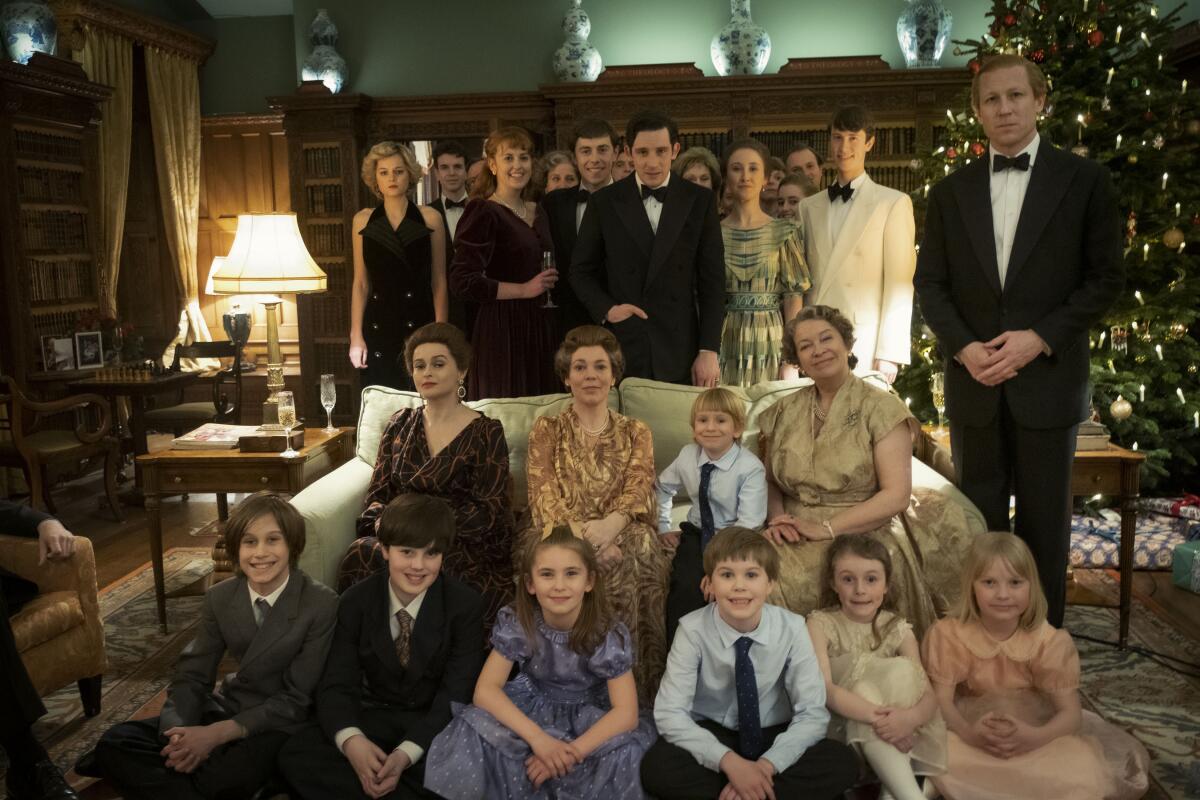 An extended royal family portrait with adults and children dressed up