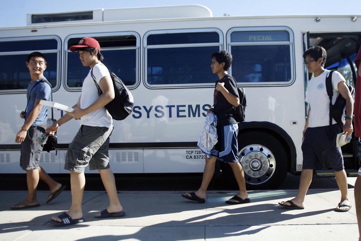 Jason Fujikuni, 17, Jonathan Lim, 16, Mako Inouye, 17, and Rikio Enouye, 17, get off the transit bus from Santa Monica in La Cañada on Thursday, June 28, 2012.