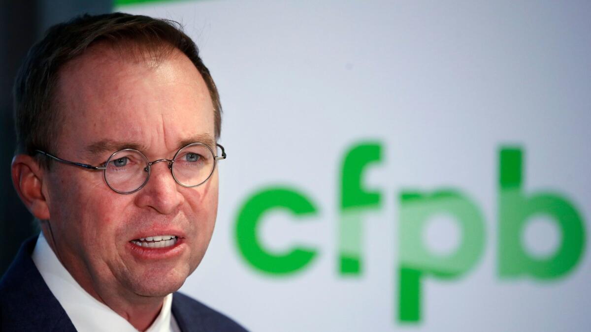 Mick Mulvaney speaks during a news conference after his first day as acting director of the Consumer Financial Protection Bureau on Nov. 27.