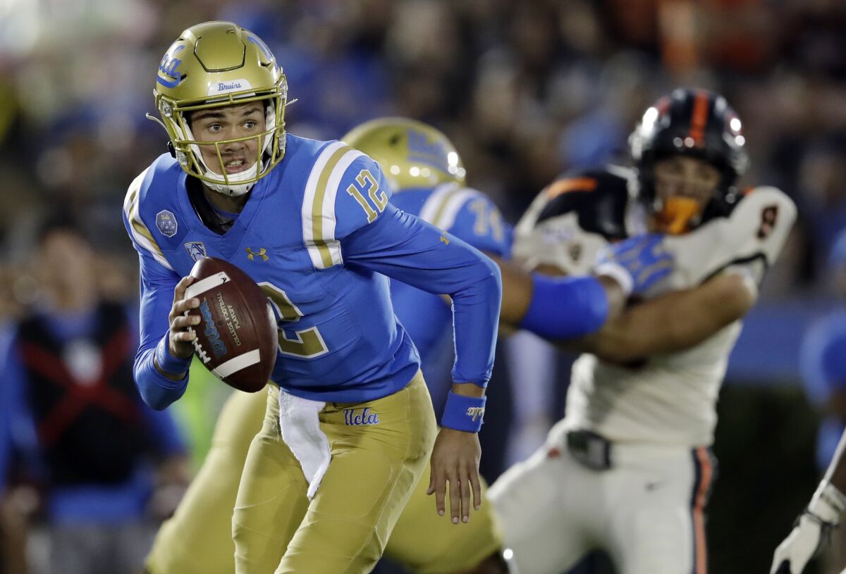UCLA quarterback Austin Burton runs out of the pocket against Oregon State during the first half of an NCAA college football game Saturday, Oct. 5, 2019, in Pasadena.
