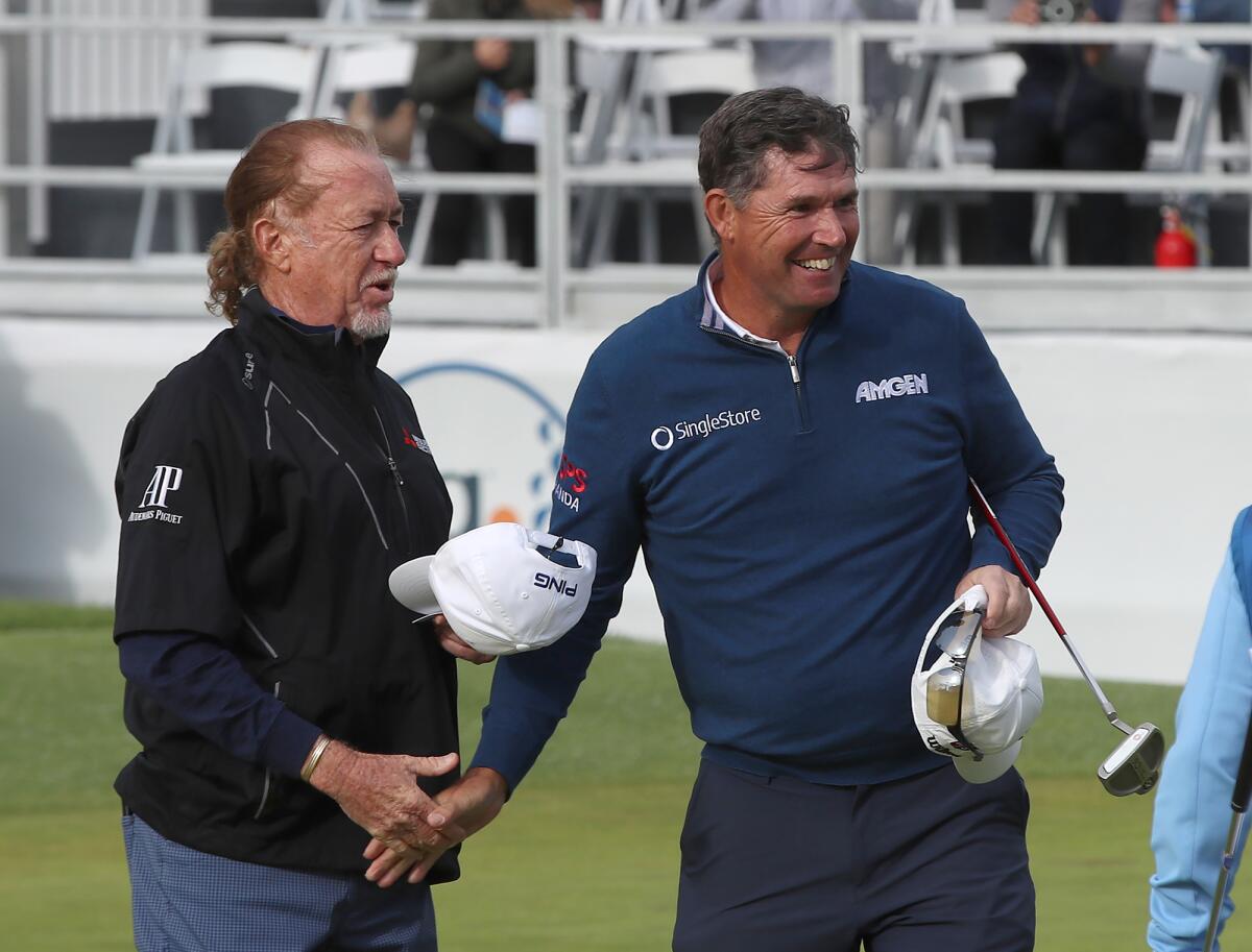 Padraig Harrington, right, is congratulated by playing partner Miguel Angel Jimenez after winning the Hoag Classic on Sunday.