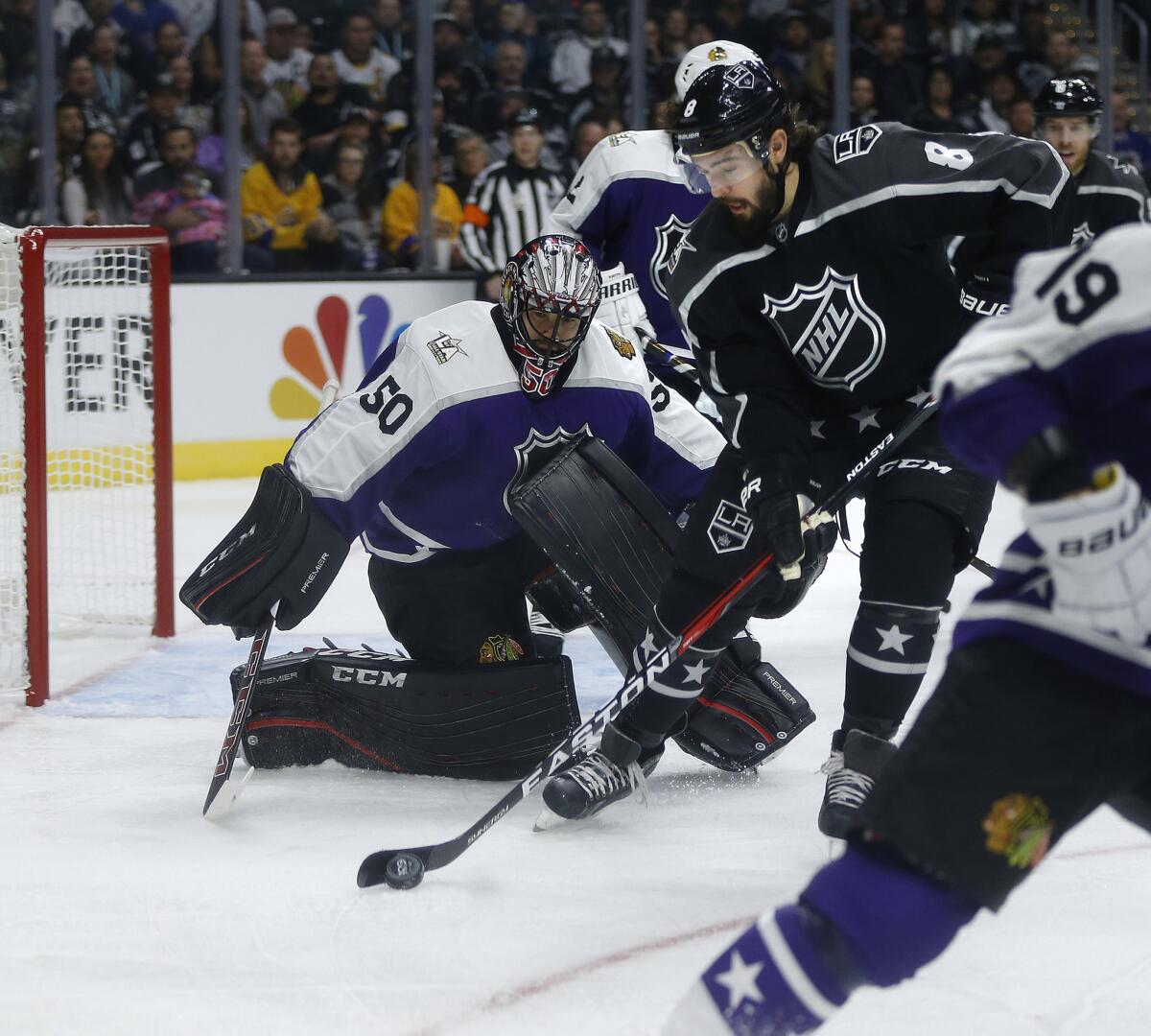 Kings defenseman Drew Doughty (8) tries to score against Chicago Blackhawks goalie Corey Crawford during the NHL All-Star game at Staples Center.