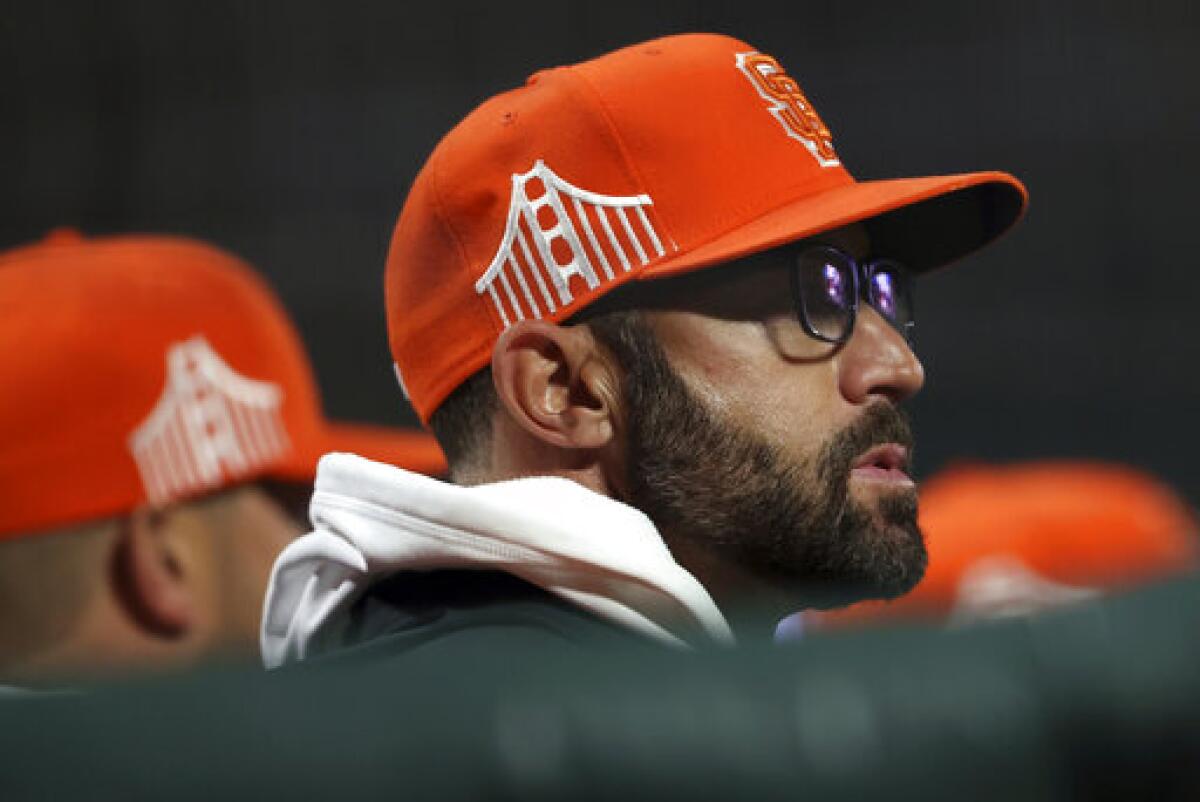 San Francisco Giants manager Gabe Kapler watches players prepare