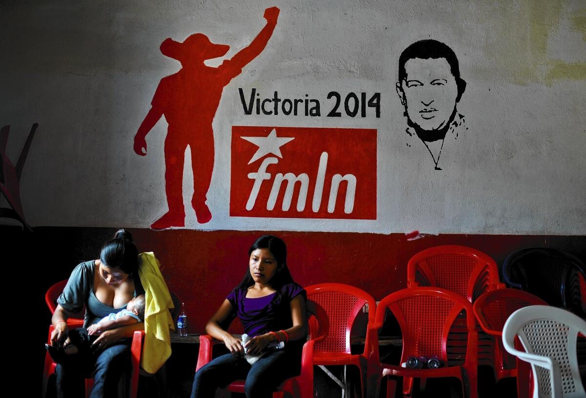 On election day in El Salvador, women rest at the Farabundo Marti National Liberation Front house in Panchimalco, south of the nation's capital. With 57% of the ballots tallied, the party's presidential candidate, Salvador Sanchez Ceren, was leading.
