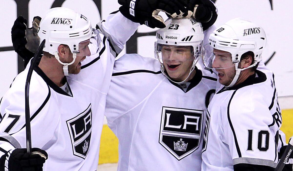 While forward Jeff Carter, left, has been the Kings' primary scorer the last two seasons, captain Dustin Brown, center, and veteran Mike Richards (10) have seen their scoring diminish.