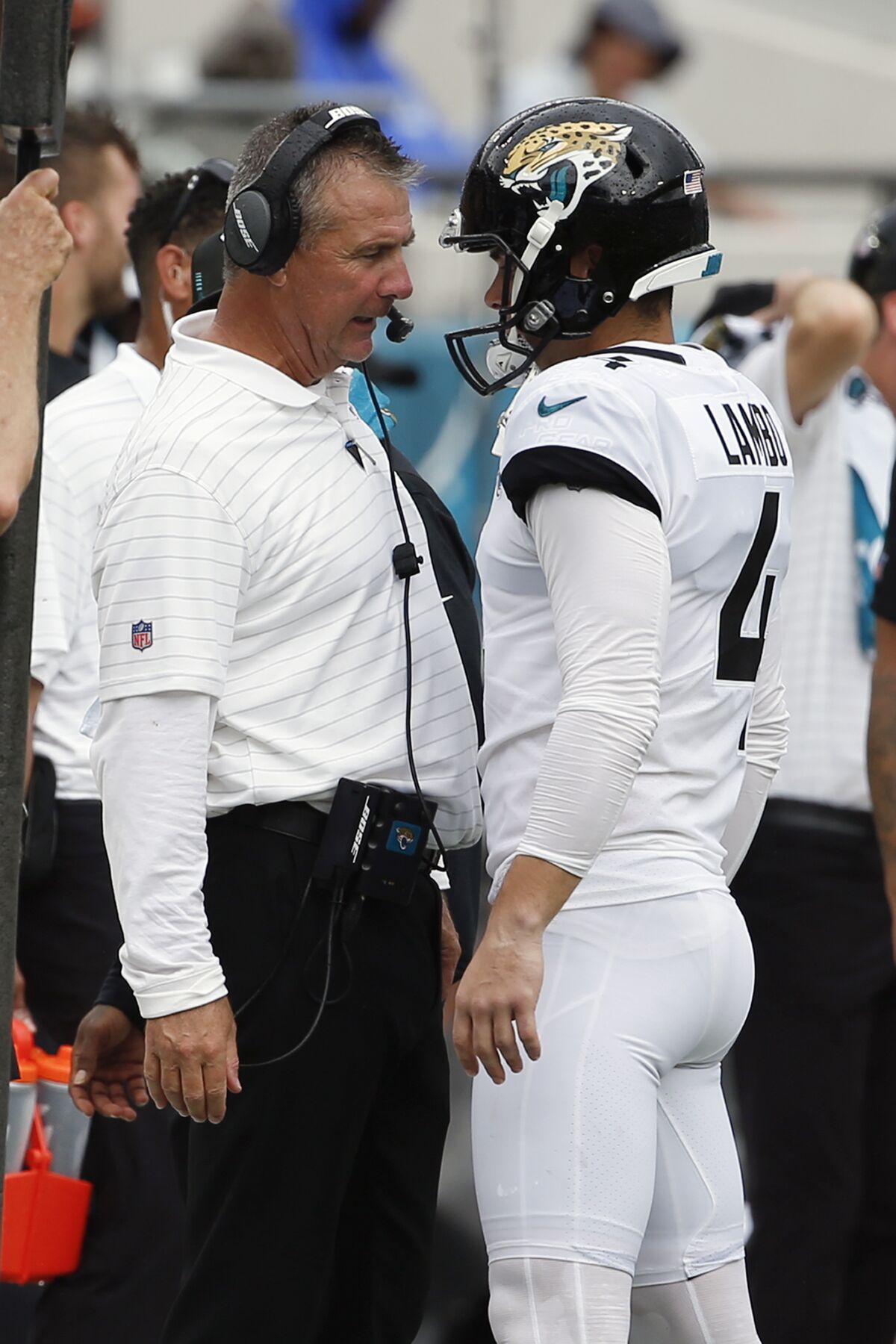 FILE - Jacksonville Jaguars head coach Urban Meyer, left, talks with place kicker Josh Lambo after Lambo missed his second field goal against the Denver Broncos during the first half of an NFL football game, Sunday, Sept. 19, 2021, in Jacksonville, Fla. Former NFL place-kicker Josh Lambo has filed a lawsuit Tuesday, May 10, 2022 against the Jacksonville Jaguars seeking more than $3.5 million in salary and damages for emotional distress caused by former head coach Urban Meyer. (AP Photo/Stephen B. Morton, File)