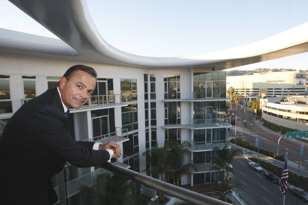 Developer Rick Caruso at his 8500 Burton Way apartment and retail complex in Los Angeles.
