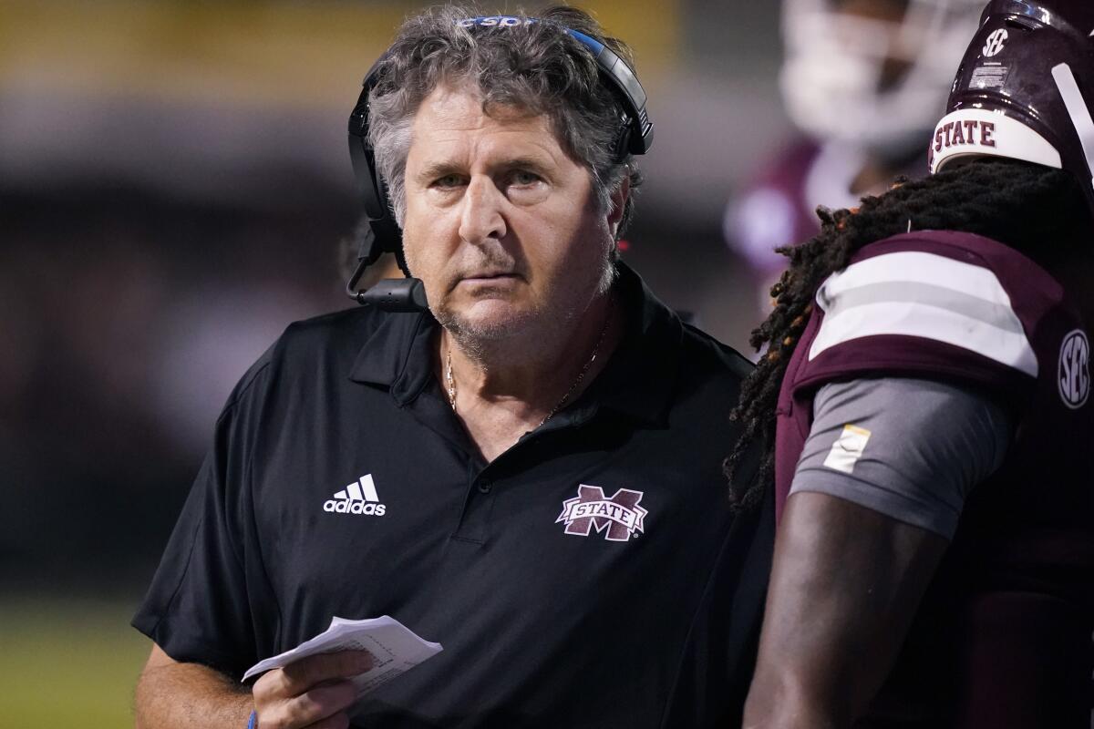 Mississippi State coach Mike Leach walks on the sideline during a game.