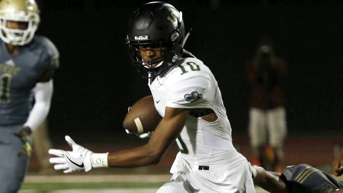 Tre Walker, shown during a game against Poly, and No. 5-ranked Narbonne picked up a hard-earned 13-6 win over Los Angeles on Friday night.