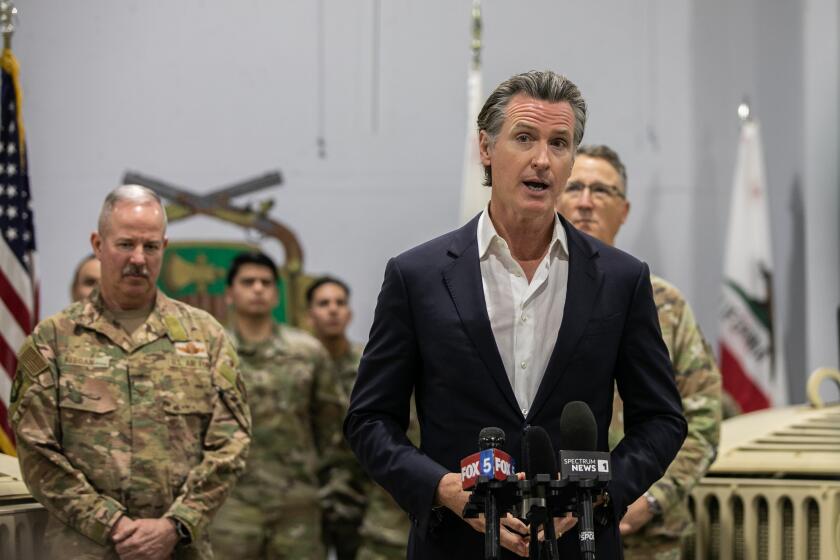 National City, CA - March 19: Gov. Gavin Newsom speaks at a press conference announcing a $30 million investment to expand the state's National Guard efforts in preventing drug-trafficking at a National City National Guard Armory in National City, CA on Sunday, March 19, 2023. (Adriana Heldiz / The San Diego Union-Tribune)