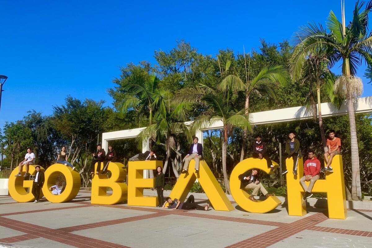 A sign with yellow letters reads "Go beach."