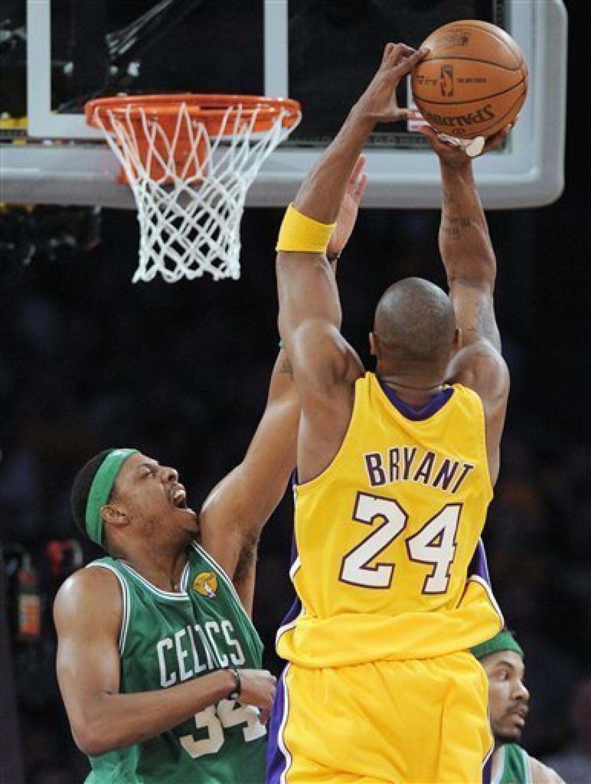 Los Angeles Lakers guard Kobe Bryant (24) dunks over Boston Celtics forward  Paul Pierce during fourth quarter action at Staples Center in Los Angeles  on December 30, 2007. The Celtics defeated the