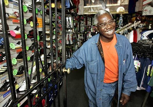 Remi Noibi, who manages a soccer store at the corner of Martin Luther King Jr. Blvd. and Figueroa near the Coliseum, would welcome a new NFL team in LA.