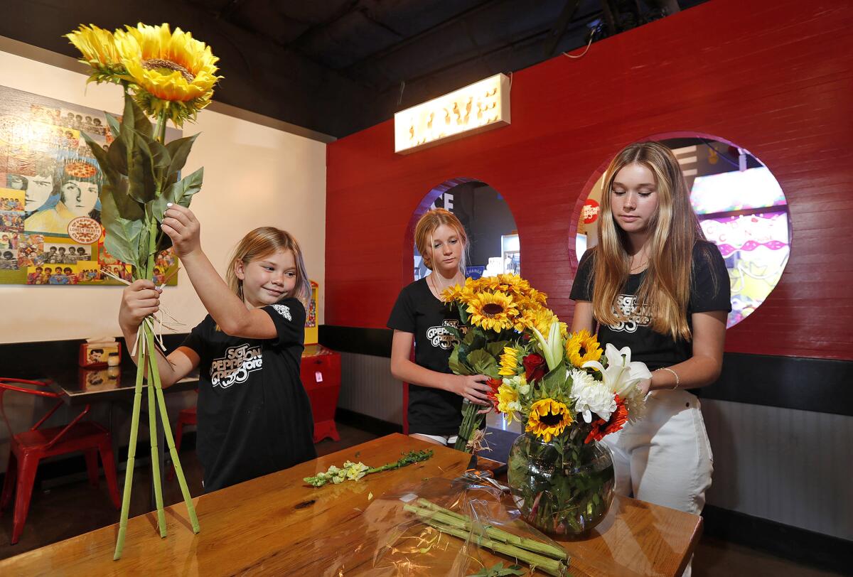 Paige, Grace and Ashley Roberts, from left, at Sgt. Pepperoni's Pizza in honor of Julian's Lego Corner. 
