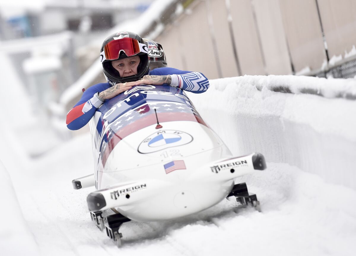 Kaillie Humphries and Sylvia Hoffman from USA finish third placed after the women's two-man bobsleigh World Cup race in Winterberg, Germany, Sunday, Jan. 9, 2022. (Caroline Seidel/dpa/dpa via AP)