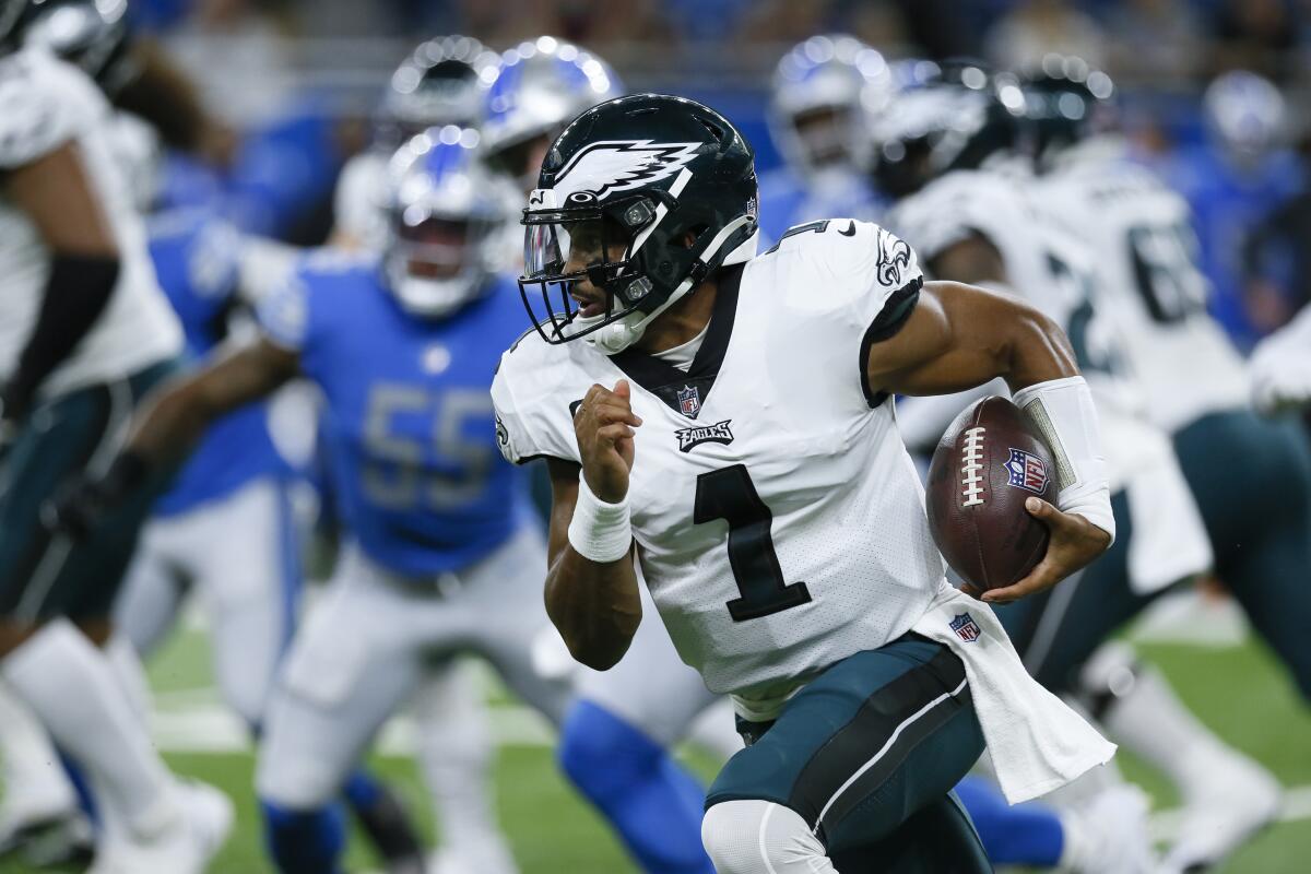 Philadelphia Eagles quarterback Jalen Hurts (1) runs the ball against the Detroit Lions in the first half of an NFL football game in Detroit, Sunday, Sept. 11, 2022. (AP Photo/Duane Burleson)